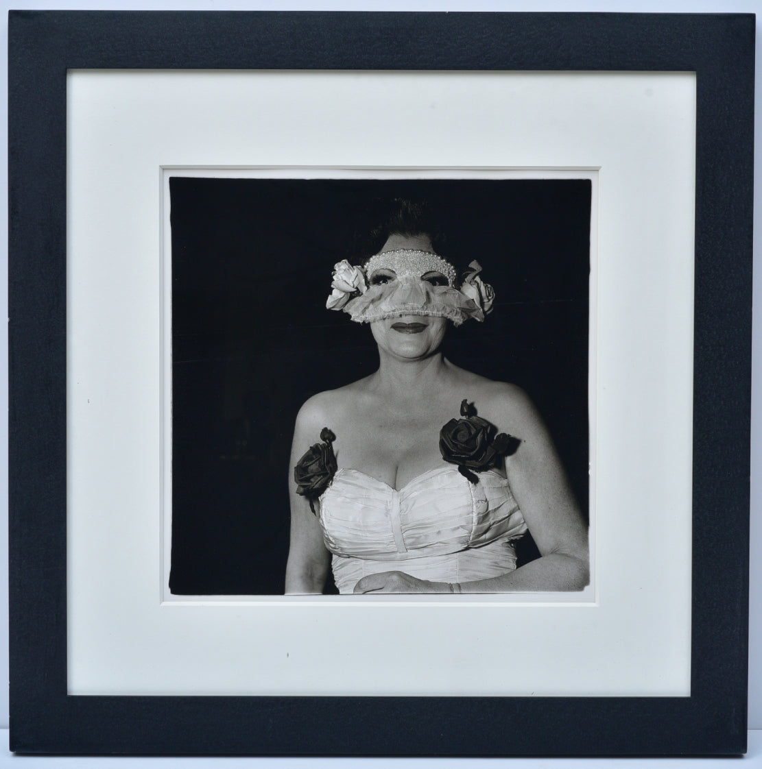 DIANE ARBUS - Lady at a masked ball with two roses on her dress, N.Y.C., 1967