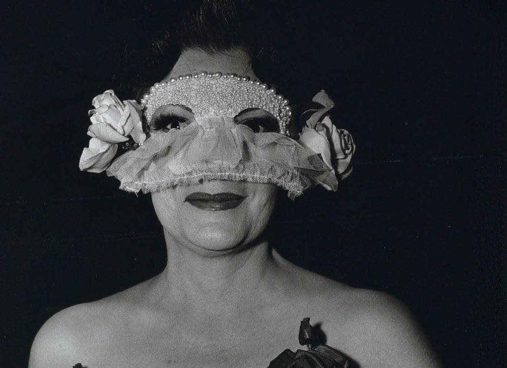 DIANE ARBUS - Lady at a masked ball with two roses on her dress, N.Y.C., 1967